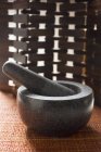 Mortar with pestle on the table — Stock Photo