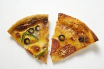 Pieces of different pizzas — Stock Photo