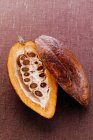 Raw cacao pod in cut — Stock Photo