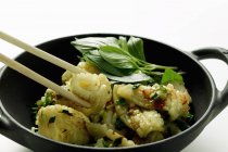 Spicy squid with Thai basil — Stock Photo