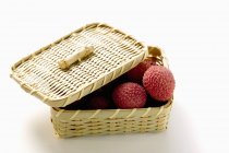 Fresh Lychees in basket — Stock Photo