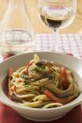 Spaghetti with anchovies and peppers — Stock Photo
