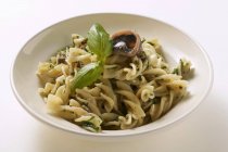 Fusilli pasta with sardines and basil — Stock Photo