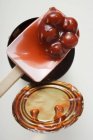 Cherry pie filling on spatula — Stock Photo