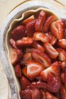 Closeup view of raw strawberry pie in metal baking tray — Stock Photo
