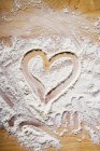 Heart drawn in flour — Stock Photo
