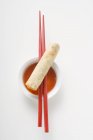 Spring roll with chopsticks — Stock Photo
