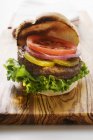 Homemade hamburger with gherkins — Stock Photo