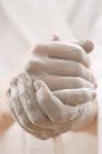 Closeup view of hands coated with cream — Stock Photo