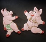Closeup view of two dancing candy pigs — Stock Photo