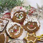 Decorated biscuits in funny faces — Stock Photo