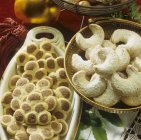Crescents and Christmas tree biscuits — Stock Photo