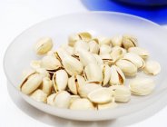 Pistachios in a small bowl — Stock Photo