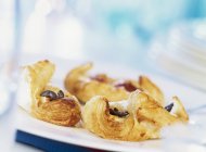 Closeup view of sweet puff pastries on plate — Stock Photo