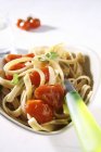 Linguine pasta with cherry tomatoes — Stock Photo