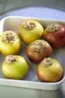 Closeup view of stuffed apples in baking tray — Stock Photo