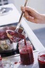 Raspberry jam in kitchen interior — Stock Photo