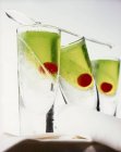 Closeup view of mint cocktails with crushed ice and cocktail cherry — Stock Photo