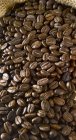 Coffee beans in sack — Stock Photo