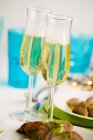 Champagne and roast loin of pork — Stock Photo