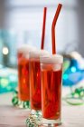 Champagne with strawberry syrup — Stock Photo