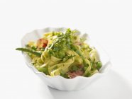 Fettuccine pasta with green sauce — Stock Photo