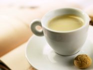 Closeup view of Espresso with almond biscuit — Stock Photo