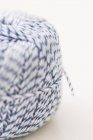 Closeup view of string ball on white surface — Stock Photo