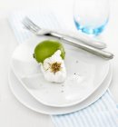 Lime and garlic with knife and fork — Stock Photo