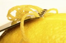 Fresh Lemon with zester — Stock Photo