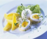Boiled eggs with mustard — Stock Photo