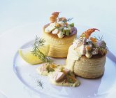 Closeup view of Vol-au-vents filled with fish ragout on white plate — Stock Photo