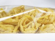 Ribbon pasta in packaging — Stock Photo