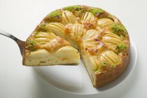 Apple cake with chopped pistachios — Stock Photo