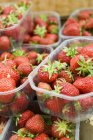 Fresh strawberries in plastic containers — Stock Photo