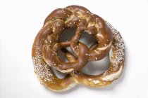 Salted pretzels on white background — Stock Photo