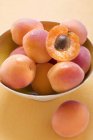 Fresh ripe apricots with half — Stock Photo