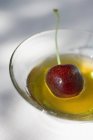 Honey with cherry in bowl — Stock Photo