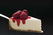 Slice of cheesecake with raspberries — Stock Photo