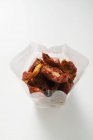 Dried tomatoes in cellophane bag — Stock Photo