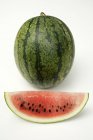 Fresh watermelon with slice — Stock Photo