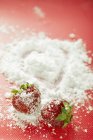 Strawberries with icing sugar — Stock Photo