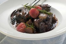 Braised oxtail with tomatoes — Stock Photo