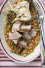 Spicy pork chop with garlic and beans — Stock Photo