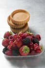 Mixed berries and tart cases — Stock Photo