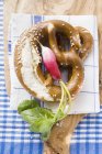 Soft pretzels and radish — Stock Photo