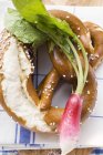 Soft pretzels and radish — Stock Photo