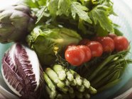 Fresh vegetables in plastic dish — Stock Photo