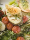 Sea bass cutlet on roasted vegetables — Stock Photo