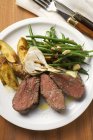 Beef steak with potato wedges — Stock Photo